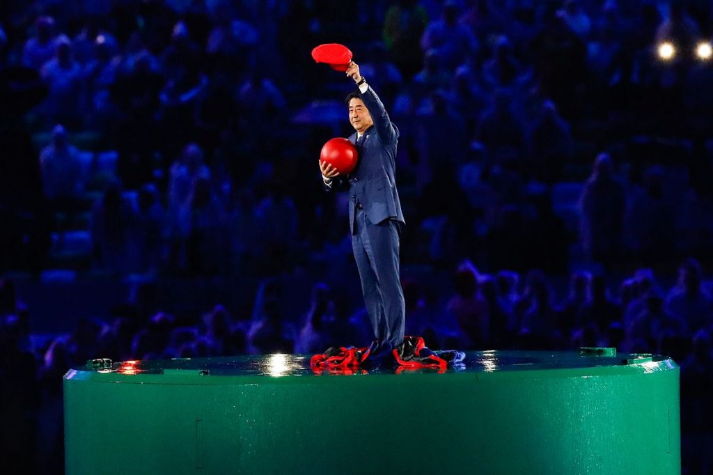 Japanese Prime Minister Shinzō Abe introduces Tokyo 2020 at the Rio 2016 Olympic Games closing ceremony. Photo By Fernando Frazão/Agência Brasil - http://agenciabrasil.ebc.com.br/rio-2016/foto/2016-08/cerimonia-de-encerramento-dos-jogos-olimpicos-rio-2016-0, CC BY 3.0 br, https://commons.wikimedia.org/w/index.php?curid=50820080