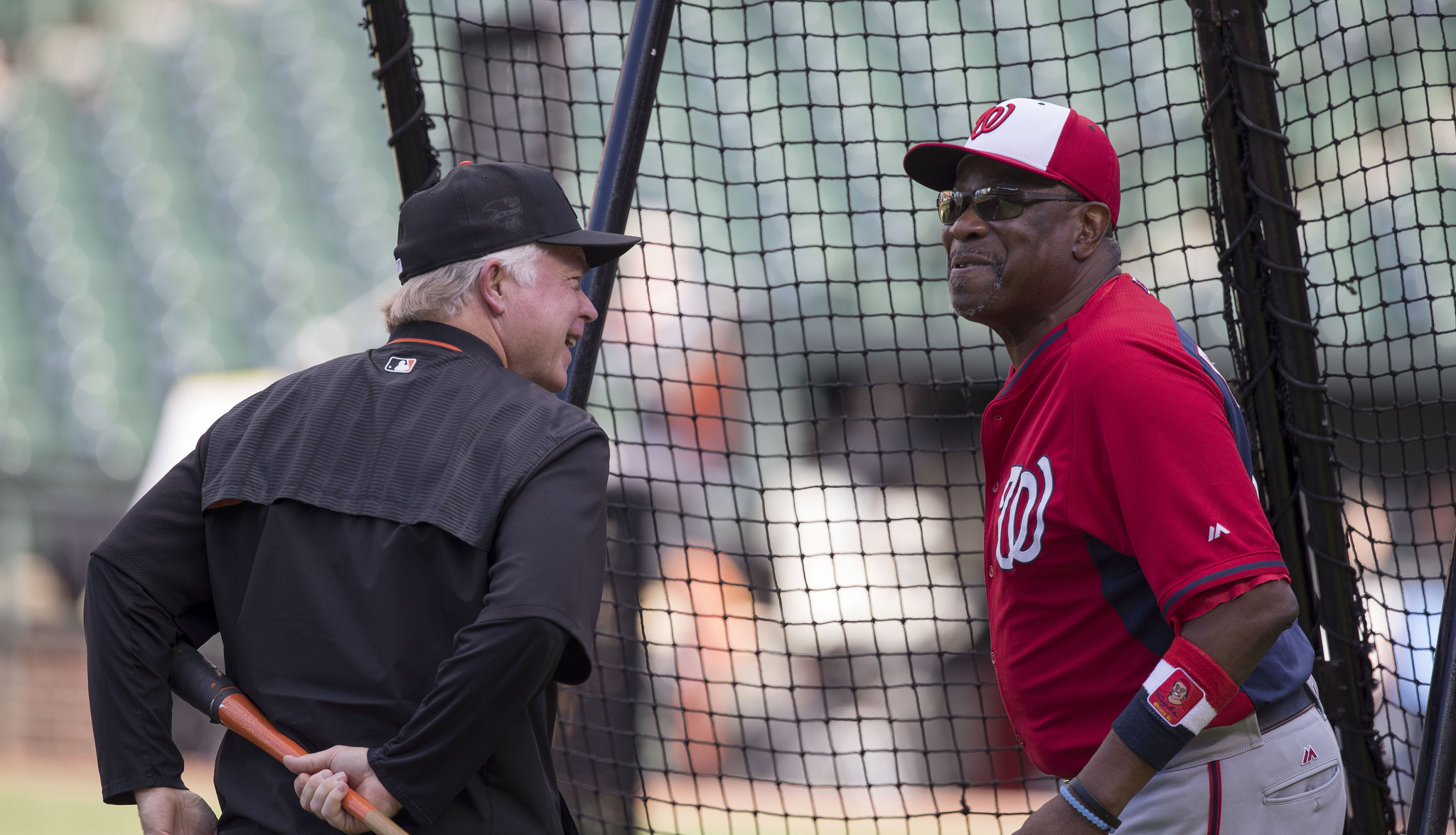 Managers Buck Showalter of the Baltimore Orioles and Dusty Baker of the Washington Nationals talk during batting practice before a game at Oriole Park at Camden Yards on August 22, 2016 in Baltimore, Maryland. Photo: Flickr/Keith Allison