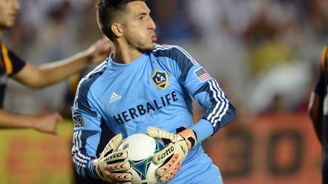 Aug 17, 2013; Carson, CA, USA;  Los Angeles Galaxy goalkeeper Jaime Penedo (18) makes a save during the game against Real Salt Lake at the StubHub Center. Galaxy won 4-2.  Mandatory Credit: Jayne Kamin-Oncea-USA TODAY Sports